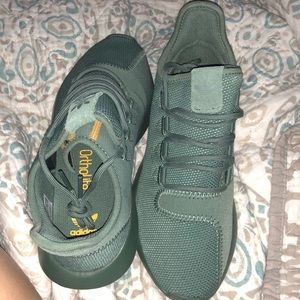 Army green adidas tubulars